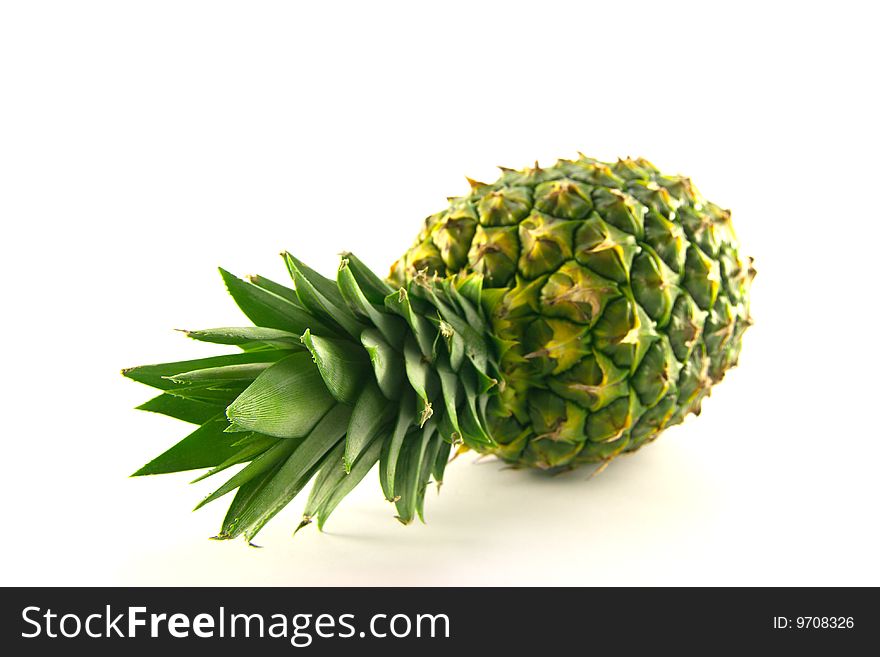 Fresh delicious looking green pineapple fruit on a white background with a clipping path. Fresh delicious looking green pineapple fruit on a white background with a clipping path