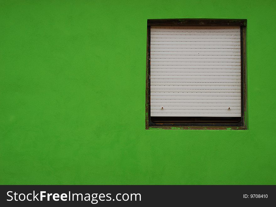 Window in a green wall. Window in a green wall