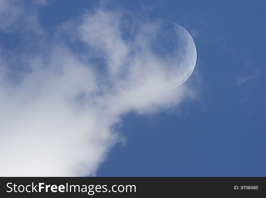 Moon In Day Sky With Clouds