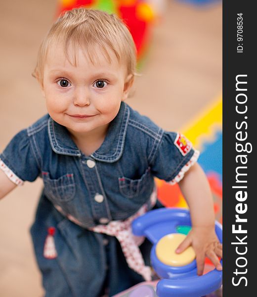 Portrait of a baby with a toy - shallow DOF