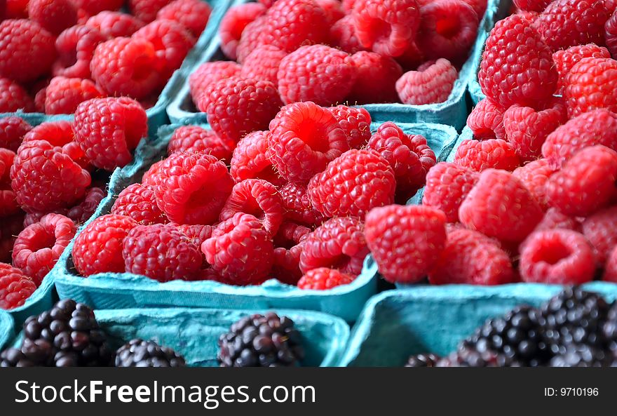 Ripe raspberries for sale at farmers market