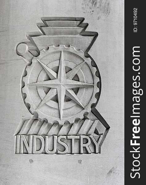 Industry emblem on concrete wall