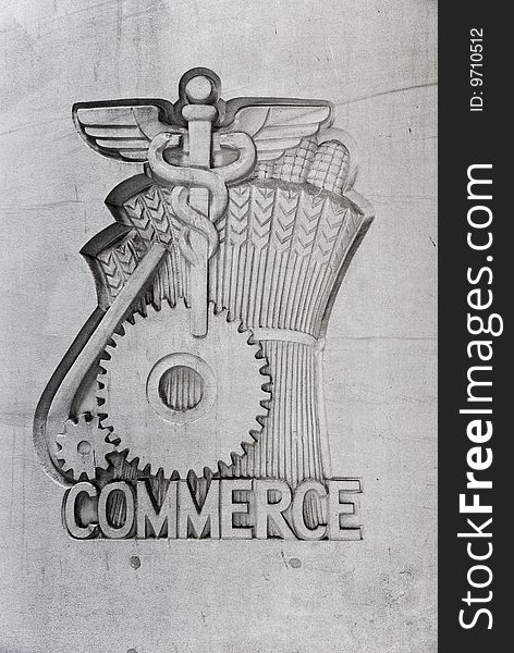 Commerce emblem on concrete wall