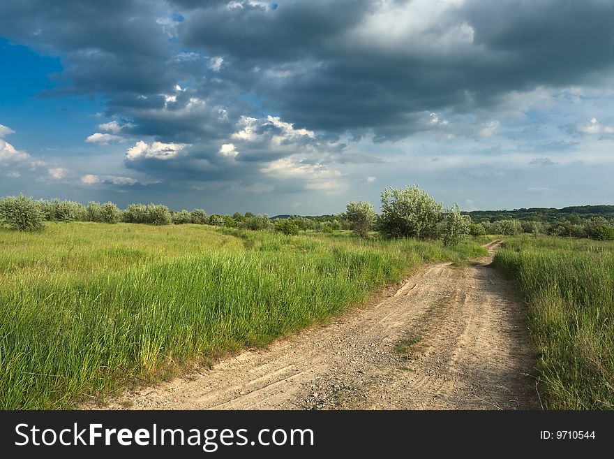 Road and sky with clouds