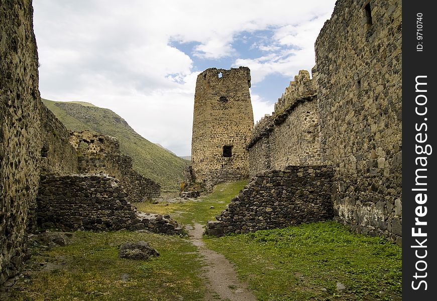 Old fortification in georgia, Caucasus. Old wall. Blue sky, summer day. Old fortification in georgia, Caucasus. Old wall. Blue sky, summer day