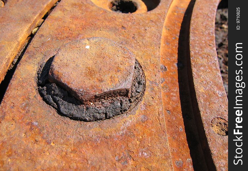 Rusty cap in a rusty metal construction. Rusty cap in a rusty metal construction