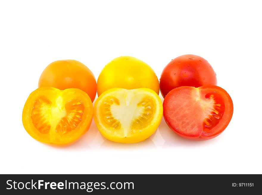 Orange, yellow and red tomatoes on white background. Orange, yellow and red tomatoes on white background