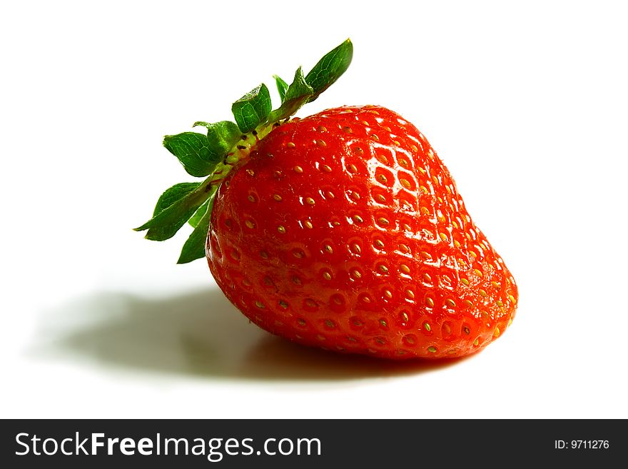 Red ripe strawberry on the white background