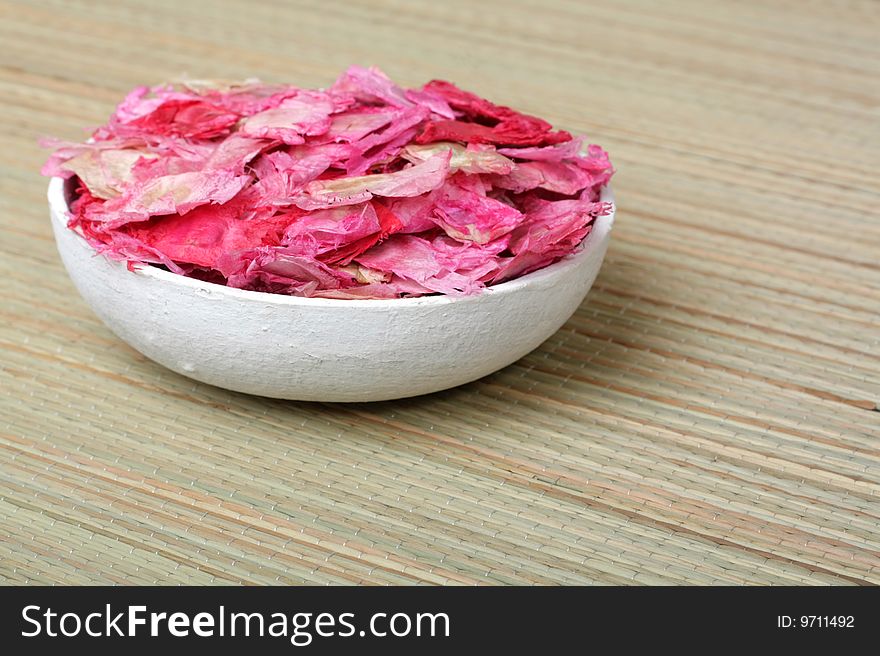 Paper bowl with dried petals. Paper bowl with dried petals