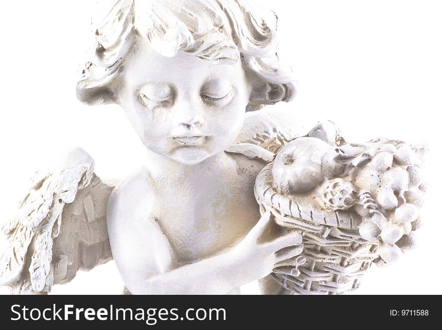 Little angel statue in high key; isolated on a white background. Little angel statue in high key; isolated on a white background.