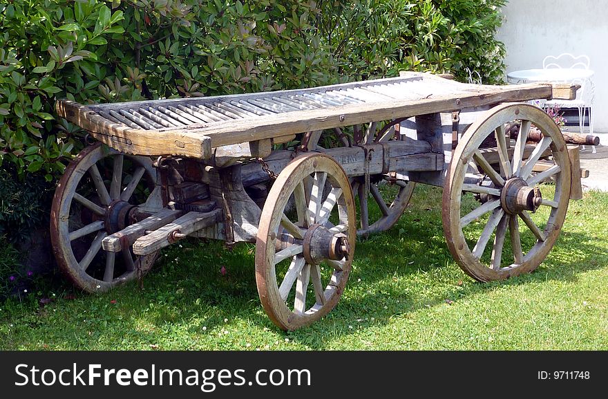 Old wooden wagon on the lawn