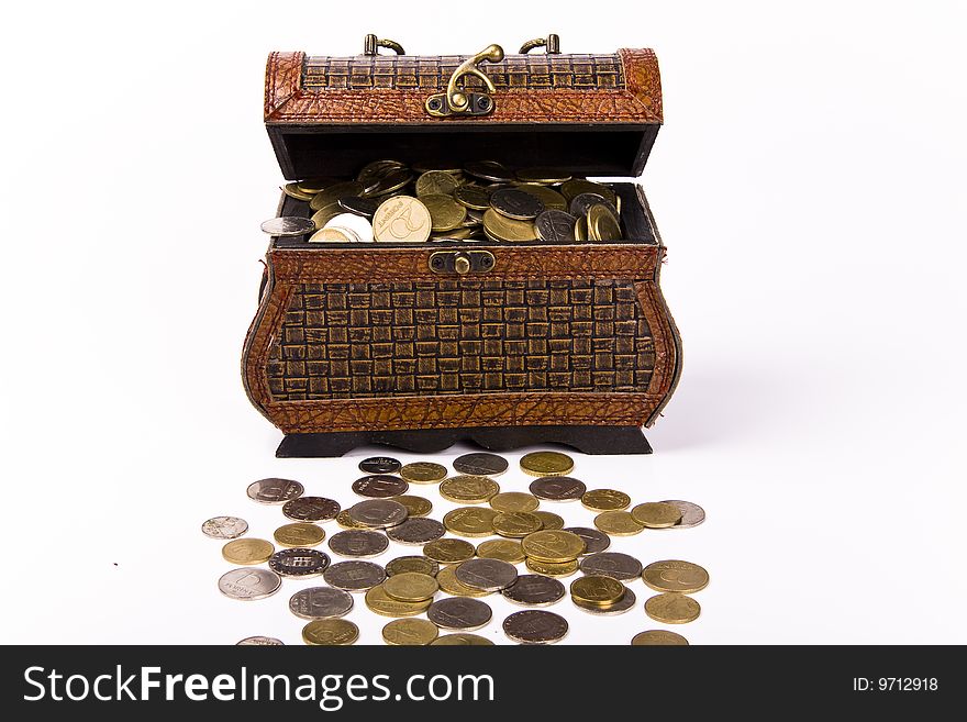 Wooden chest with coins inside isolated. Wooden chest with coins inside isolated
