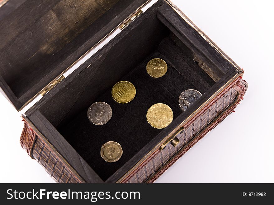 Wooden chest with coins inside isolated. Wooden chest with coins inside isolated