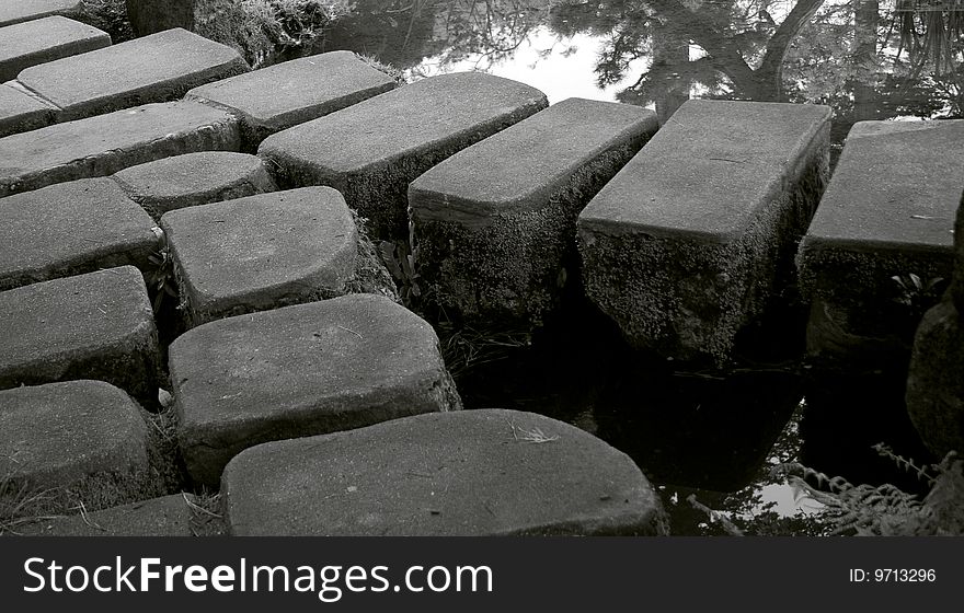 Bridge of stones in japanese garden