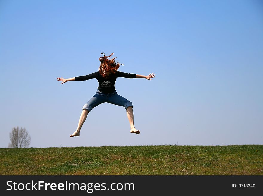 The girl taken in a jump like hanging in the air. The girl taken in a jump like hanging in the air