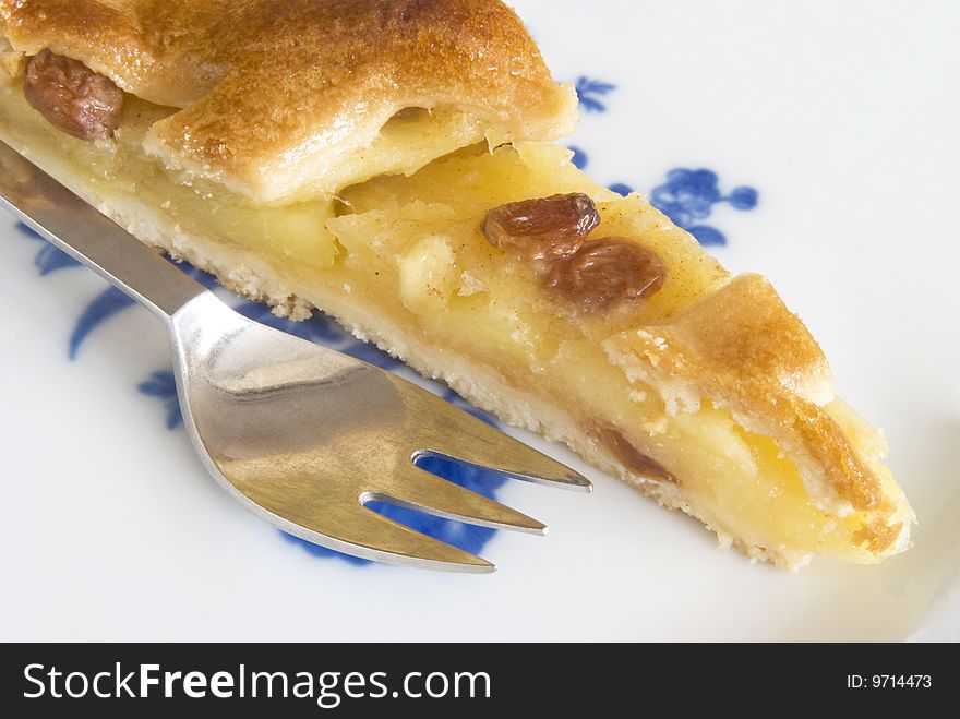 Close-up of apple and raisin tart with fork. Close-up of apple and raisin tart with fork