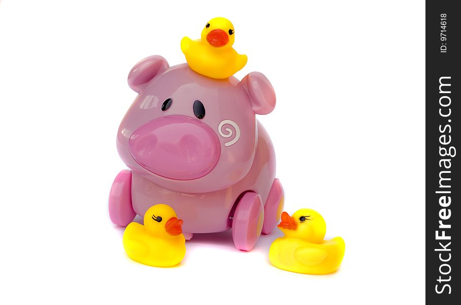 Children's toys: the Pink pig on castors and yellow ducklings