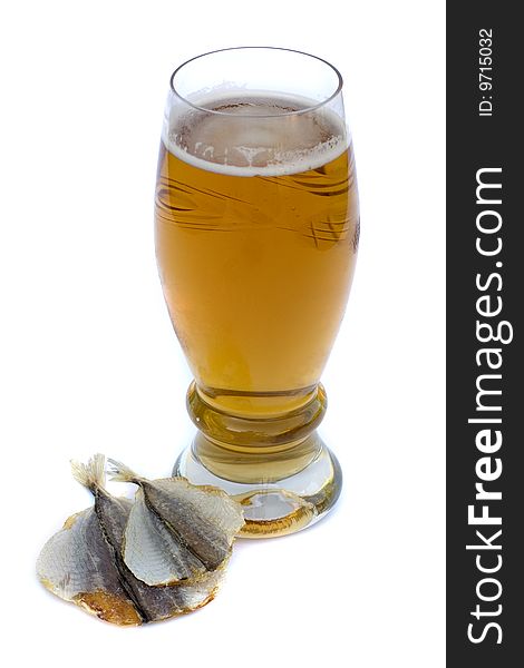 Food and drinks: Beer in a glass and salty fish on a white background. Food and drinks: Beer in a glass and salty fish on a white background
