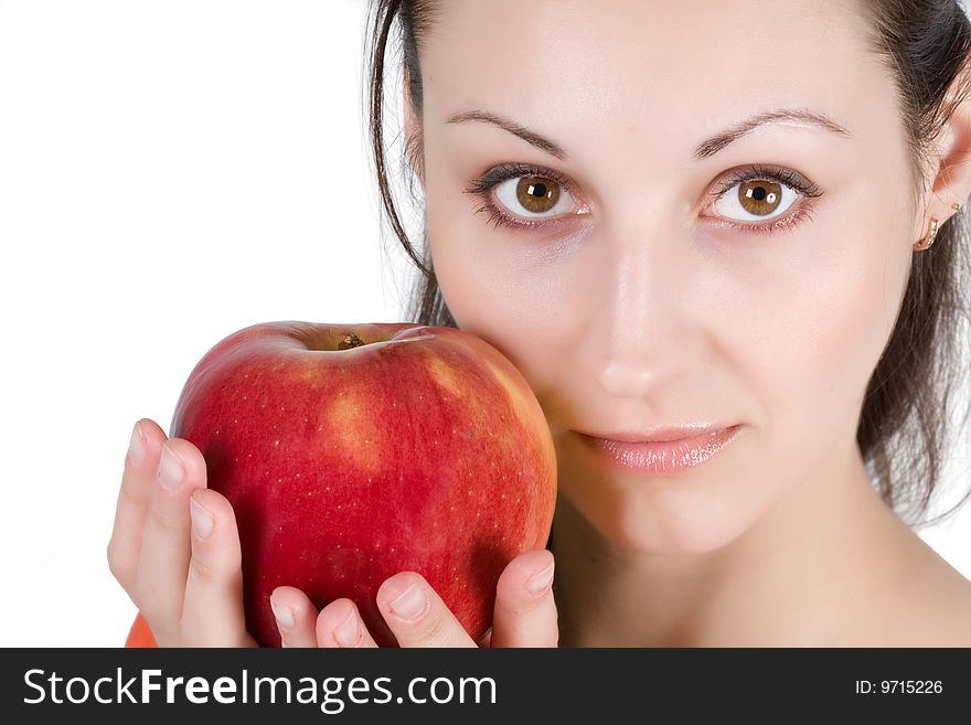 Woman eating apple on a white background