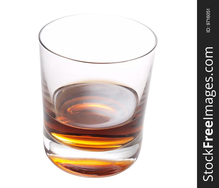 Color photo of a glass of whiskey on a white background