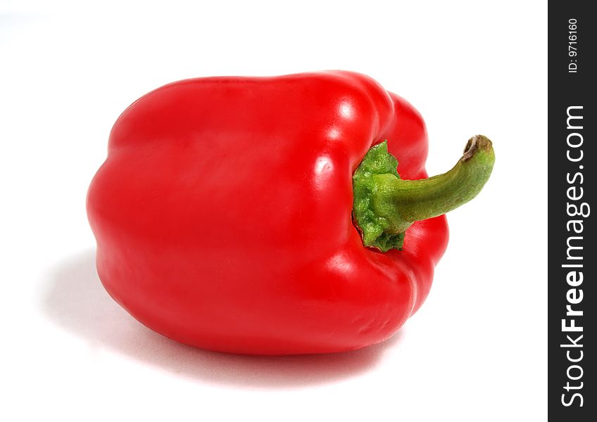 Color photograph of red peppers on a white background