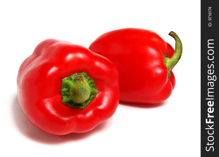 Color photograph of red peppers on a white background. Color photograph of red peppers on a white background