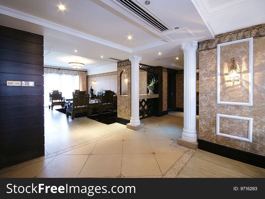 Large hall area in modern home with pillars. Large hall area in modern home with pillars.