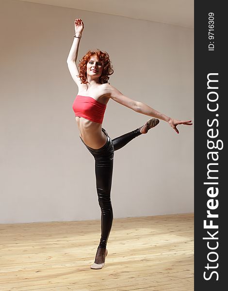 Modern style dancer posing on studio background. Modern style dancer posing on studio background