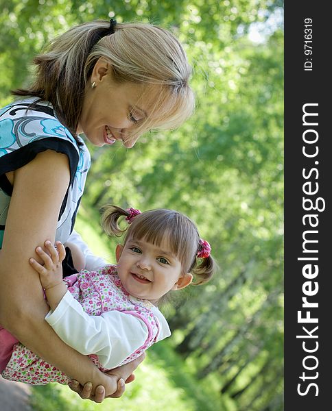 Happy Mother And Daughter Playing Outdoor, Summer