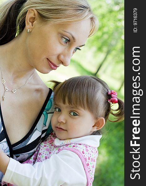 Mother And Daughter Outdoor In Summer Park