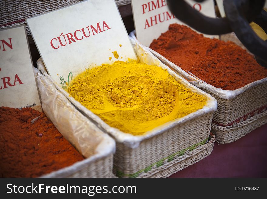 Different spices in wicker baskets