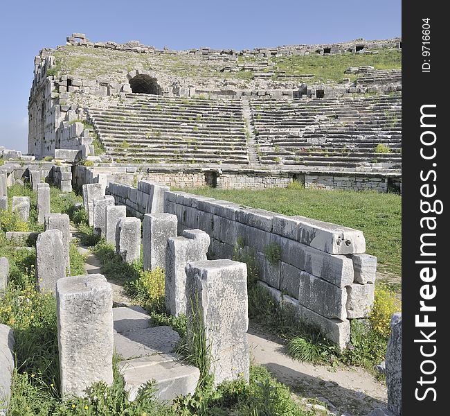 The ancient amphitheater at Miletus, Turkey, showing the columns that once supported the stage, with the amphitheater seating behind