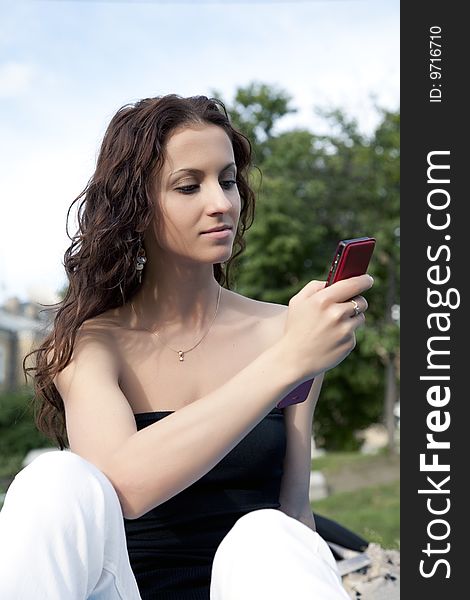 Woman with mobile phone outdoor