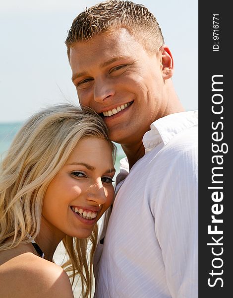 Juvenile couple full of joy near the beach