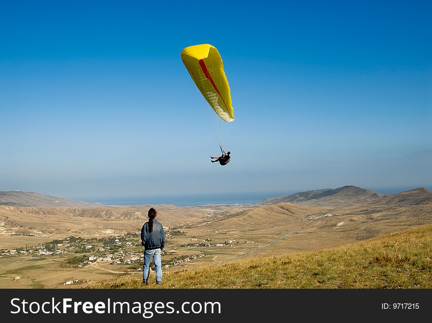 Paraglider in the sky of the Crimea, Black Sea distance. Paraglider in the sky of the Crimea, Black Sea distance