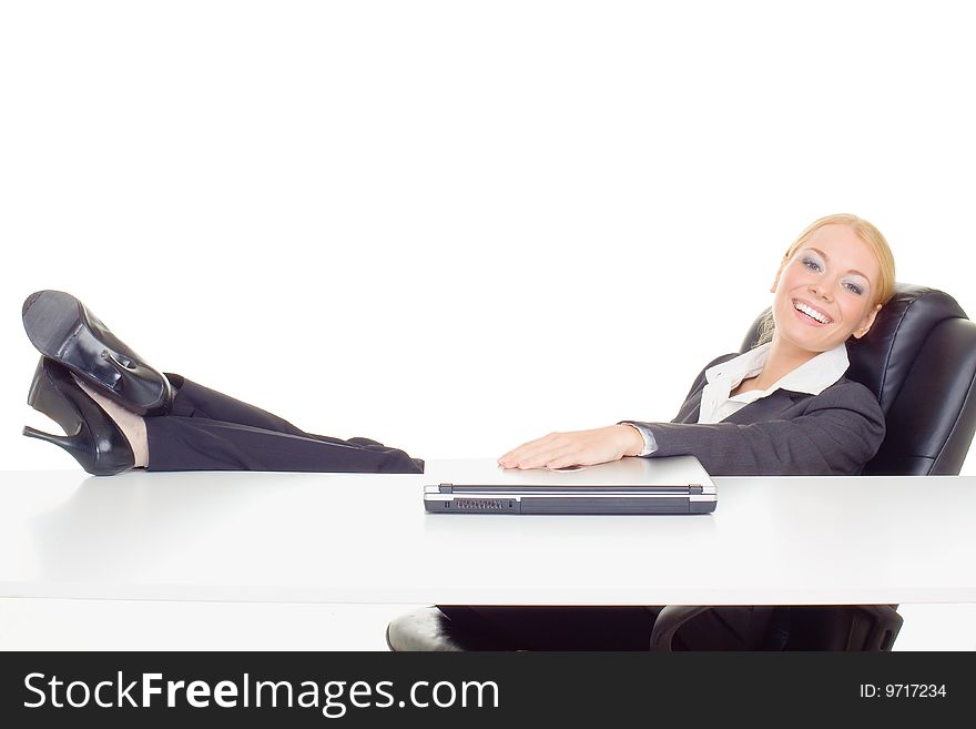 Businesswoman relaxing with legs on table