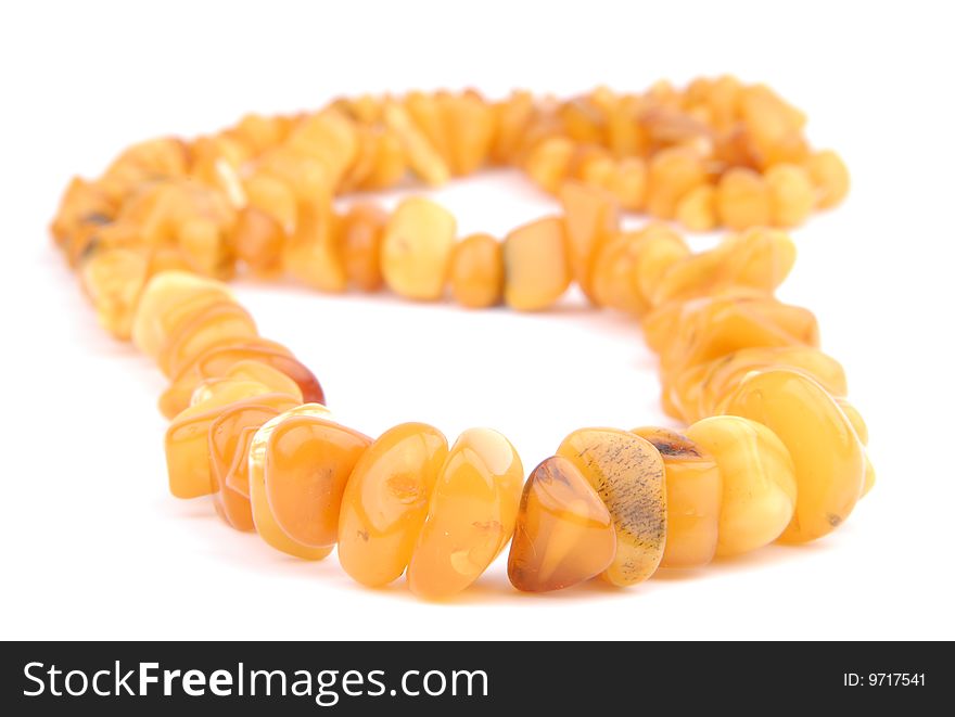 Amber necklace on a white background isolated. Amber necklace on a white background isolated