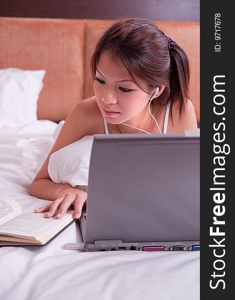 An image of an asian female student studying. An image of an asian female student studying