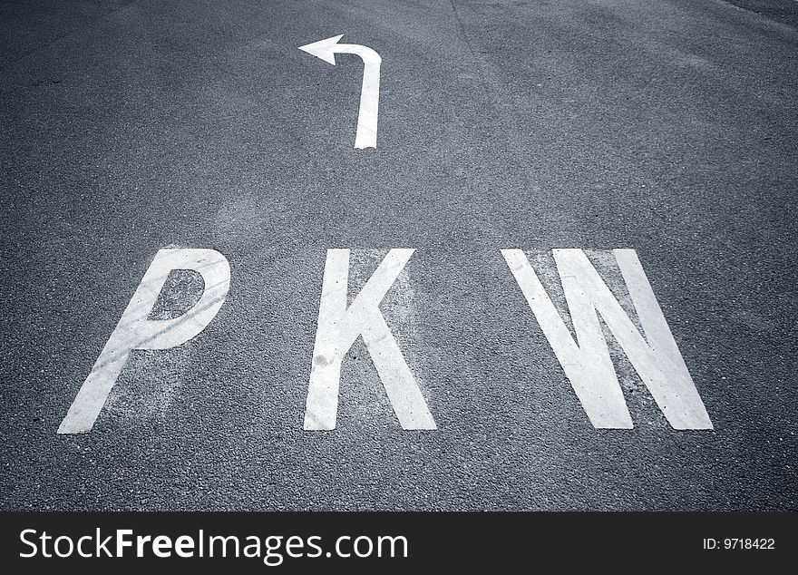 PKW sign and arrow sign on asphalt. PKW sign and arrow sign on asphalt.