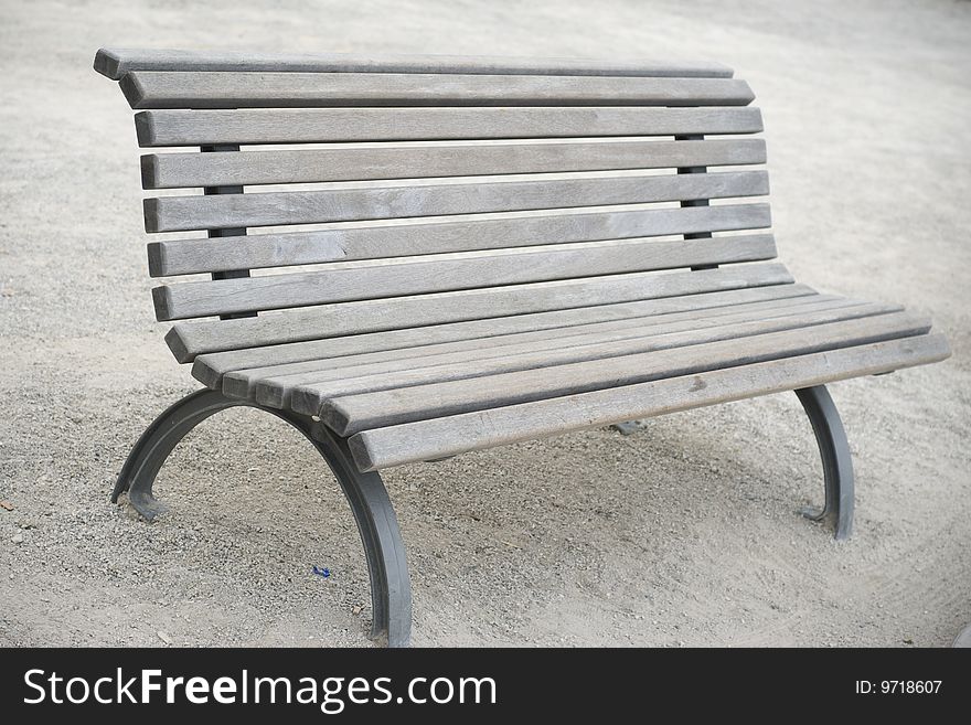 A Single Wooden Bench in the Park. A Single Wooden Bench in the Park.