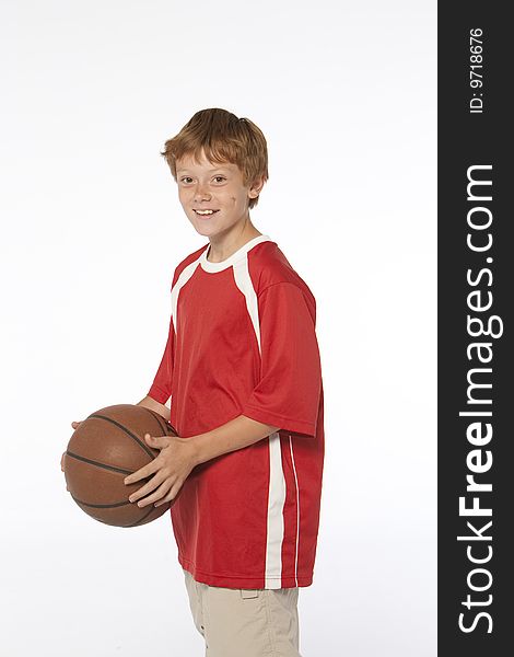 Young man on white holding basketball. Young man on white holding basketball