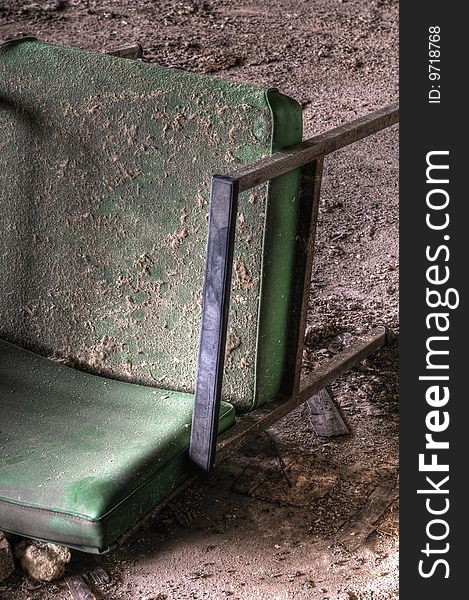 Old Green Chair in an Abandoned Building