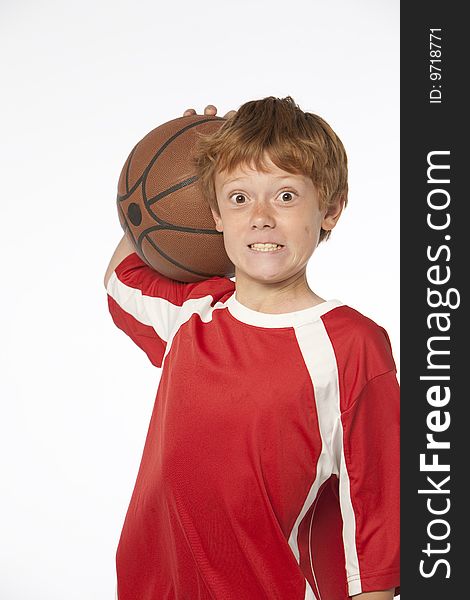 Young man on white holding basketball. Young man on white holding basketball