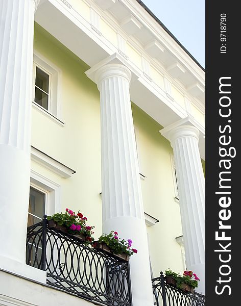 Front wall of white building with columns