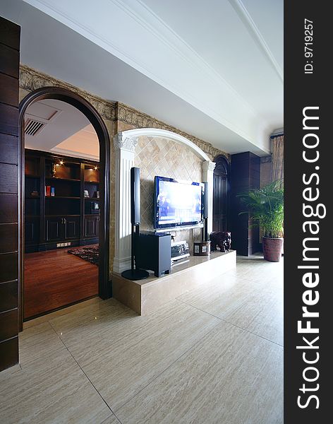 Media room in modern home with arched doorway. Media room in modern home with arched doorway.
