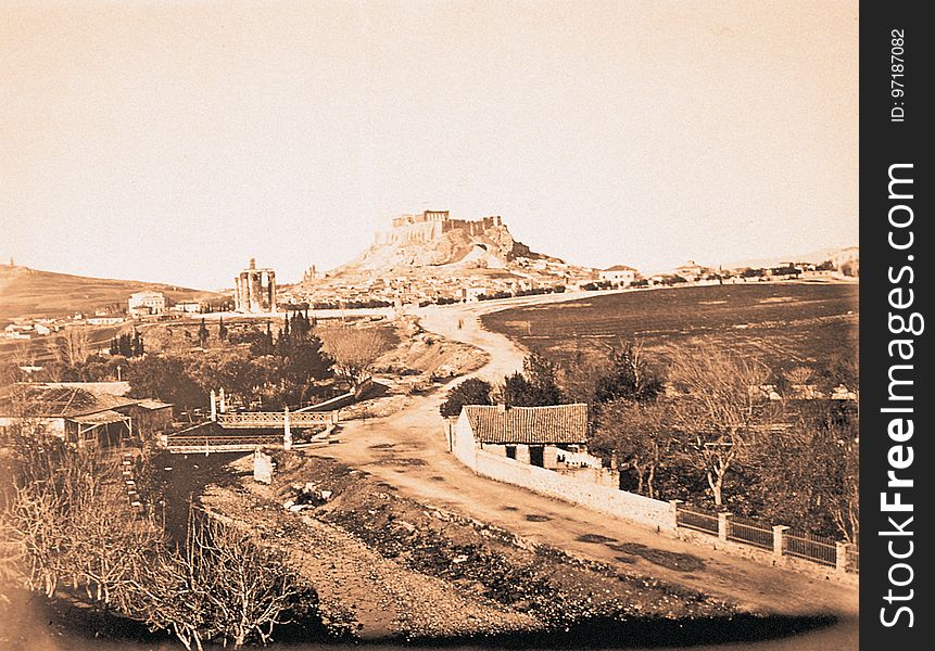 A view along the banks of the Ilissos, with the Protestant Cemetery to the right &#x28;out of view&#x29;. Zappeion has yet to be built. Dated by presence of the hermit&#x27;s dwelling, columns of Jupiter, which was demolished in 1866. A view along the banks of the Ilissos, with the Protestant Cemetery to the right &#x28;out of view&#x29;. Zappeion has yet to be built. Dated by presence of the hermit&#x27;s dwelling, columns of Jupiter, which was demolished in 1866.