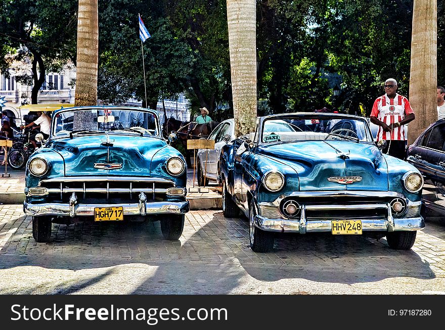 Blue Convertible Vintage Car Parked during Daytime