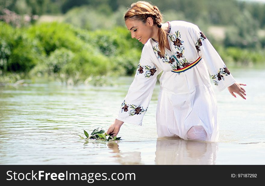 Woman in White Dress in the Water at Daytime
