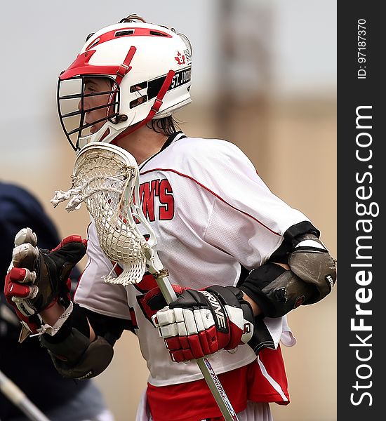 Man Wearing White and Red Lacrosse Uniform