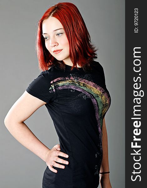 Cute teen girl with red hair posing for portrait. Cute teen girl with red hair posing for portrait.